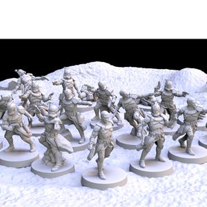 May include: A collection of miniature figurines depicting armored figures in various action poses. The figures are light gray and stand on circular bases, arranged on a textured, snowy surface. The scene includes rock formations.