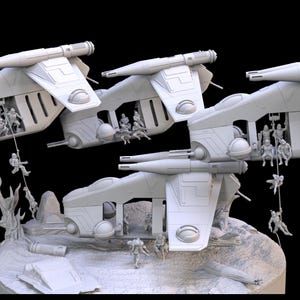 May include: A detailed, light gray model depicting multiple spacecraft in flight, with figures rappelling from the open bays. The scene is set on a rocky terrain with additional figures and structures, all against a black background.