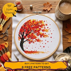 Könnte beinhalten: Ein Kreuzstichprojekt in einem Holzrahmen mit einem Baum, dessen rote, orange und gelbe Herbstblätter im Wind wehen. Das Motiv befindet sich auf weißem Aida-Stoff, begleitet von Stickgarn, einer Schere und einem Fingerhut. Text: PDF Digital Download.