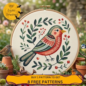May include: A cross-stitch pattern of a colorful bird surrounded by green leaves and red berries, set in a wooden embroidery hoop. The text "PDF Digital Download" is in a yellow circle with bats. The text "BUY 1 PATTERN TO GET 8 FREE PATTERNS" is in a yellow banner.