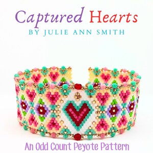 May include: A colorful beaded bracelet with a heart design. The bracelet is made with an odd count peyote stitch and features a variety of colors, including pink, red, green, and white. The bracelet is titled "Captured Hearts" by Julie Ann Smith.