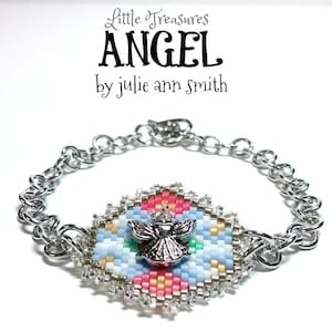 May include: A silver chain bracelet with a beaded angel charm. The charm is a colorful beaded design with a silver angel in the center. The bracelet is labeled "Little Treasures ANGEL by julie ann smith".