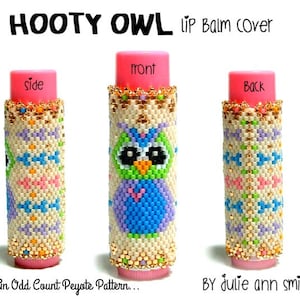May include: A beaded lip balm cover with an owl design. The cover is made with a peyote stitch pattern and features a variety of colors, including white, blue, green, pink, and gold. The cover is labeled "HOOTY OWL LIP Balm Cover" and "An Odd Count Peyote Pattern... BY Julie ann smith".