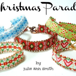 May include: Five beaded bracelets with Christmas-themed designs. The bracelets are made with white, red, green, and blue beads. The bracelets are arranged in a circle on a white background. The text "Christmas Parade" is written in black at the top of the image. The text "by julie ann smith" is written in black at the bottom of the image.