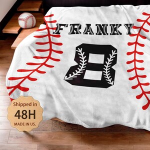 May include: White baseball-themed fleece blanket with red stitching, a black number 8, and the name "FRANKY" in black block letters.