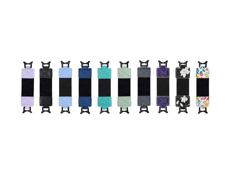 May include: Ten different colored and patterned wrist straps with black adjustable closures. The straps are made of fabric and have a variety of designs, including floral, geometric, and solid colors.