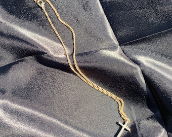 Elegant 14k golden cross necklace.