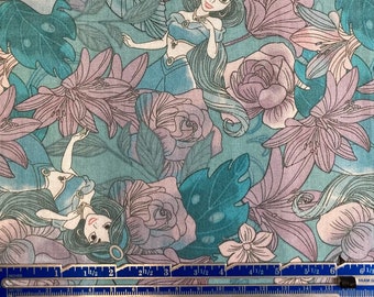 May include: A teal blue fabric with a repeating pattern of a princess from Aladdin, flowers, and leaves. The princess is wearing a blue outfit and has long dark hair. The flowers are pink and purple.