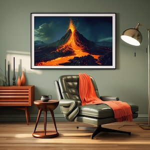 May include: A framed print of a volcano erupting with lava flowing down the side. The print is hanging on a green wall in a living room setting with a leather armchair and a side table.