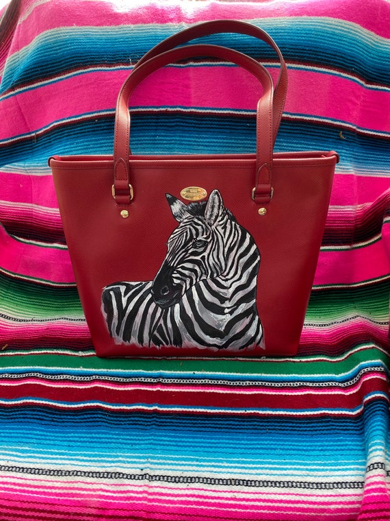 Like new red designer Coach purse textured leather handbag with hand painted Zebra