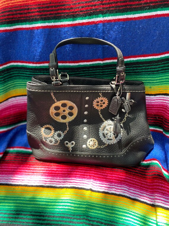 Like new designer Coach purse pebbled leather handbag with hand painted steampunk gears