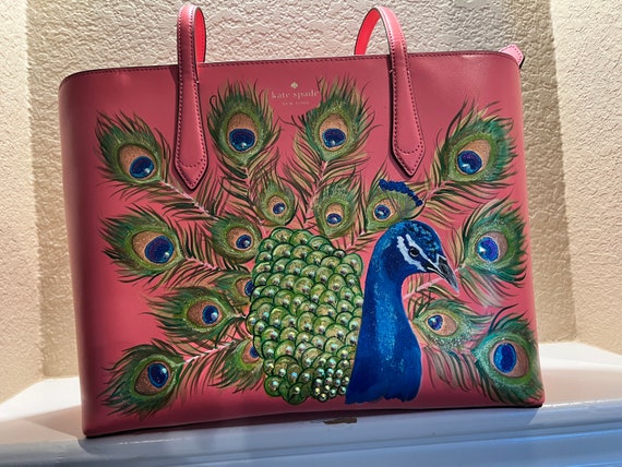 Like new extra large tote style salmon pink Kate Spade purse leather handbag with hand painted peacock