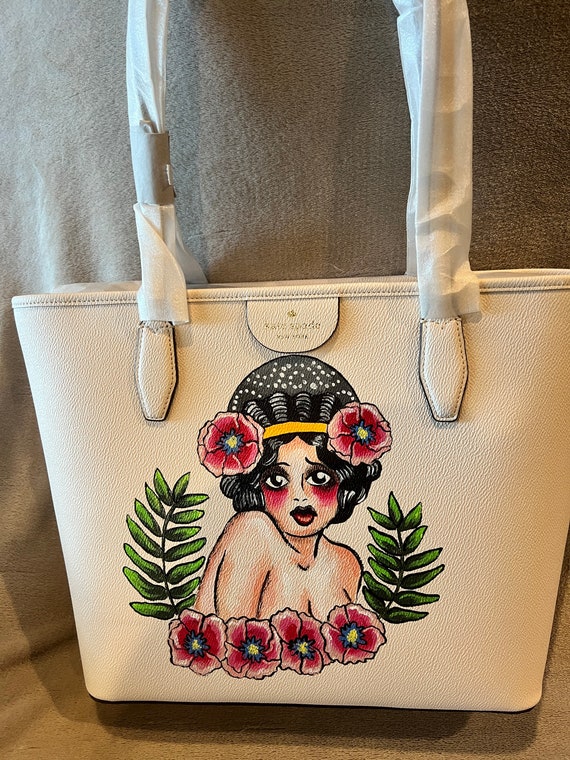 NWT extra large tote style cream Kate Spade purse pebbled leather handbag with hand painted pinup girl.