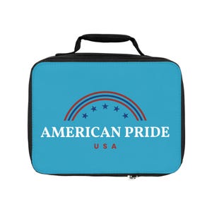 May include: A rectangular lunch bag with a black handle and zipper. The bag features a light blue background with the text "AMERICAN PRIDE USA" in white and a red, white, and blue design.