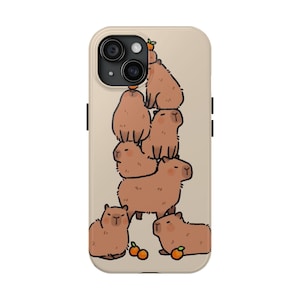 May include: A phone case with a cute illustration of a stack of capybaras with oranges on top. The capybaras are brown and the oranges are orange.