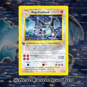 May include: A yellow Mega Charizard Pokémon card with a blue and gray Charizard illustration. The card has text including "Mega Charizard", "150 HP", and "Fire Spin 120". The card is 5'7" long and weighs 200 lbs.