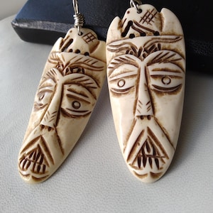 Carved Horn Mask Pendants