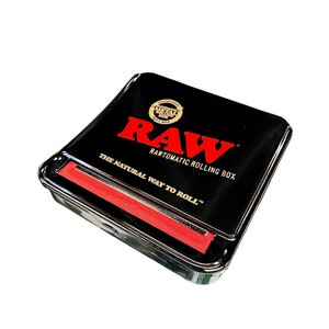 May include: Black metal rolling box with a red RAW logo and the text "RAWTOMATIC ROLLING BOX" and "THE NATURAL WAY TO ROLL".