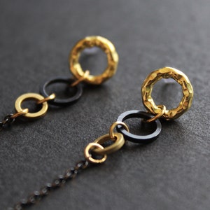 Earbud earrings in black and gold with silicone loop ring, anti-lost earpods holder chain, long dangle brass circle round stud modern Obila image 2