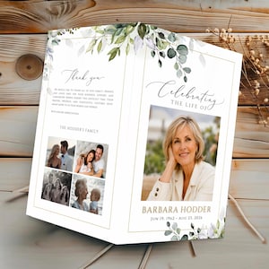 May include: A folded funeral program featuring a white background with green watercolor leaves. The front displays a portrait of Barbara Hodder, dates, and the text Celebrating the Life of. The back includes a thank you note and four photos.