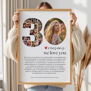 May include: A framed print with a wooden frame. The print features a collage of photos, the number "30", and the text "reasons we love you". The print also includes a photo of a woman and a list of reasons. The overall theme is a personalized gift.