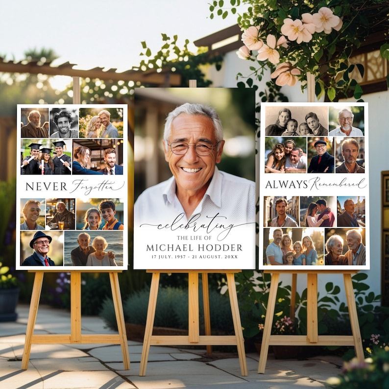 May include: Three vertical memorial signs on wooden easels. The center sign features a large portrait of an older man with glasses, text reading "celebrating THE LIFE OF MICHAEL HODDER 17 JULY 1957 - 21 AUGUST 20XX". Side signs include photo collages.