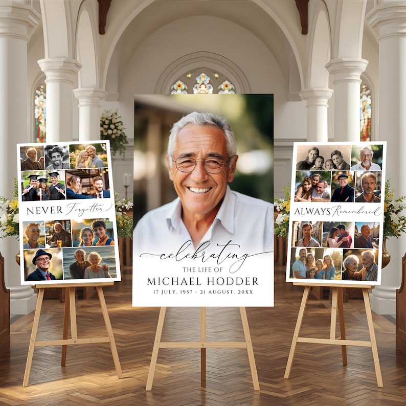 May include: Three funeral memorial signs on wooden easels. The center sign features a large portrait of a man with the text "celebrating THE LIFE OF MICHAEL HODDER 17 JULY, 1957 - 21 AUGUST, 20XX". The side signs display photo collages with "NEVER Forgotten" and "ALWAYS Remembered" text.