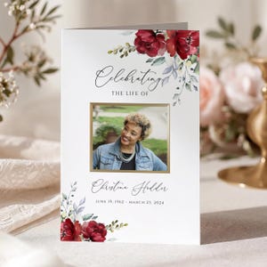 Könnte beinhalten: Eine weiße Trauerkarte mit Aquarell-roten Rosen und grünem Blattwerk. Der Text lautet Celebrating The Life Of, Christina Hodder, und June 19, 1962 - March 23, 2024. Ein rechteckiges Foto zeigt eine Person in einer Jeansjacke.