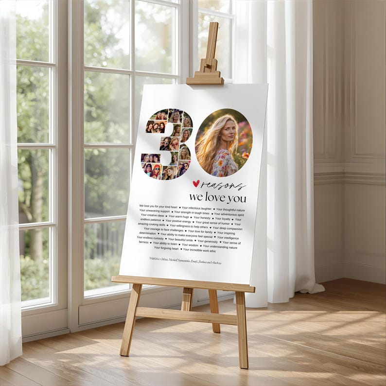 May include: A wooden easel displays a white poster with the text "30 reasons we love you." The poster features a photo of a woman and a collage of photos forming the number 30. The background includes a window and white curtains.