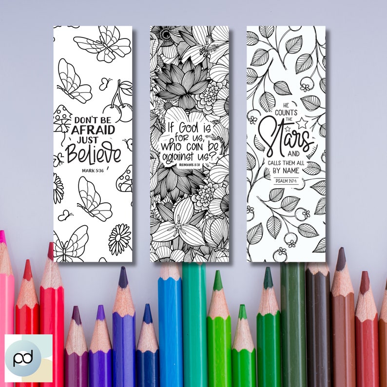 May include: Three black and white printable bookmarks with inspirational quotes and floral designs. The first bookmark says "Don't be afraid just believe" with a butterfly and cherry design. The second bookmark says "If God is for us, who can be against us?" with a floral design. The third bookmark says "He counts the stars and calls them all by name" with a star and floral design.
