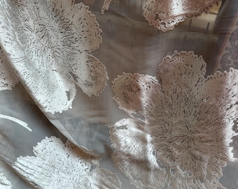 Rayon/viscose devore’ in bright white, tone on tone large floral.