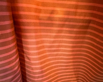 All silk shantung tightly woven in a copper/bronze two-color stripe.