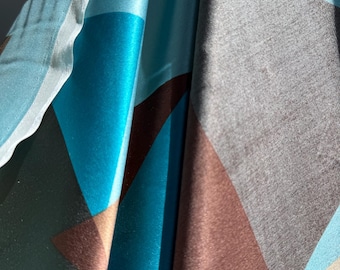 Silk charmeuse with geometric pattern in chocolate, turquoise and azure blue.