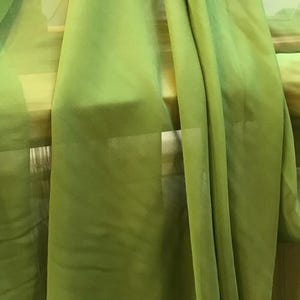 Soft, pear green silk chiffon with a slight texture to surface.