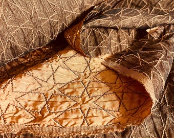 Satin and tulle with embroidered stars.  Copper with chocolate hues.