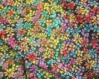 Polyester chiffon in a vintage floral multicolored pattern.