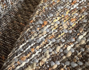 Chanel-style tweed boucle’ in neutral colorway.  Jacket weight.