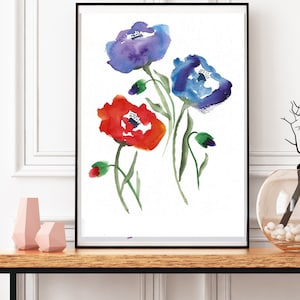 Puede incluir: Una pintura de acuarela enmarcada de tres flores. Las flores son azules, rojas y moradas. La pintura est&aacute; sobre un fondo blanco.