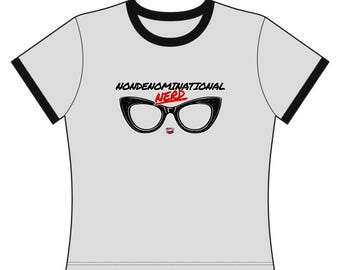 May include: A light gray ringer t-shirt with black trim on the collar and sleeves. The chest features a graphic of black cat-eye glasses with the text NONDENOMINATIONAL in black and NERD in red above the glasses and a small red logo below.