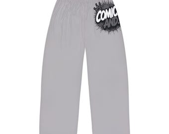 May include: Light gray lounge pants featuring a black and white graphic on the upper right leg. The graphic displays a crown icon above the text COMIC AND, surrounded by a black ink splatter design. The pants have a wide-leg fit and an elastic waistband.