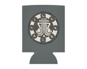 May include: A gray beverage can cooler with a white circular design. The design features a central emblem with stylized lines and shapes, surrounded by a ring of symbols and text. The cooler has a cutout at the bottom.