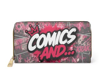 May include: A rectangular zip-around wallet featuring a comic book-inspired graphic in shades of pink, black, and white. The front displays the text "COMICS AND..." in bold white and pink lettering, accented by a small pink crown icon and "KRAK" text.