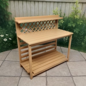 May include: A white ceramic mug with a black handle and the text "But First, Coffee" in a bold, black font. The mug is set against a neutral background, highlighting its simple design.