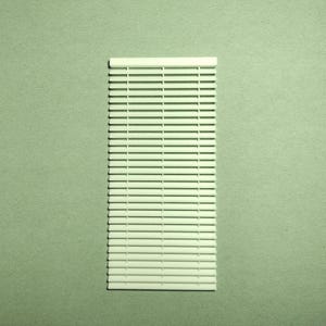 May include: A rectangular, off-white venetian blind with horizontal slats. The blind is positioned vertically against a muted green background. The slats are evenly spaced, creating a clean, minimalist aesthetic. The top of the blind has a thicker, solid section.