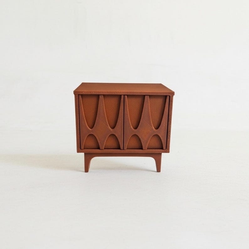 Miniature dollhouse nightstand in a brown retro 60s furniture style, with arched pattern door fronts.