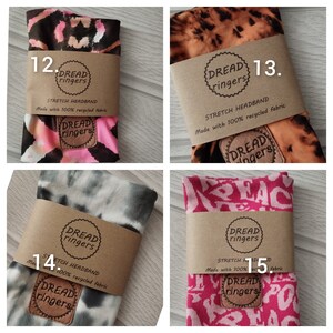 May include: Four different headband styles made from recycled fabric. Each headband has a brown label with the text "Dread ringers" and "Stretch Headband Made with 100% recycled fabric". The headbands are in various patterns, including tie-dye, leopard print, and a pink and white pattern with the word "Peace" repeated.
