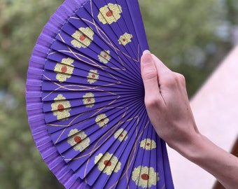 A collection of hand painted fans.