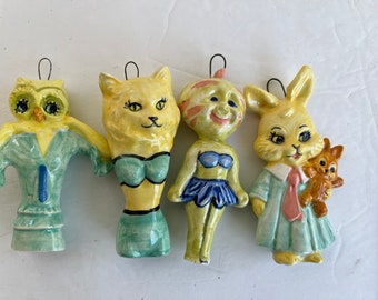 Four yellow  wall dolls