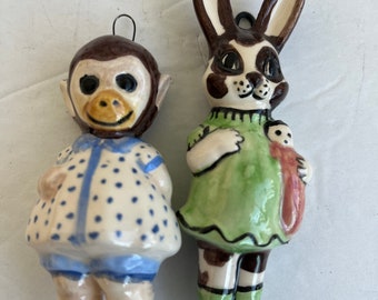 A tiny Monkey and a Bunny ceramic wall dolls