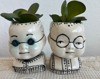 Moe and Joe  doll head planters